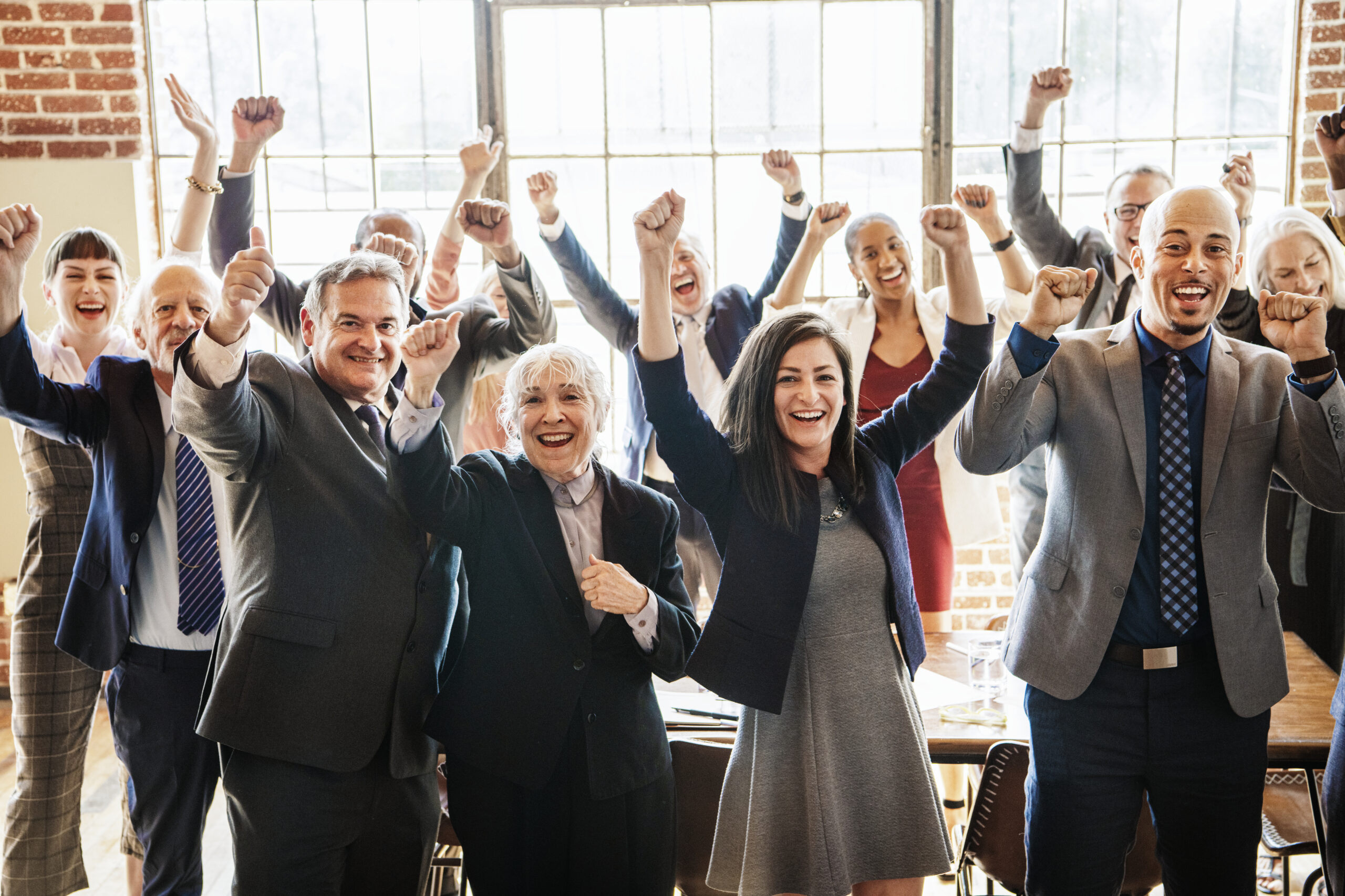Successful business team celebrating growth and leadership success