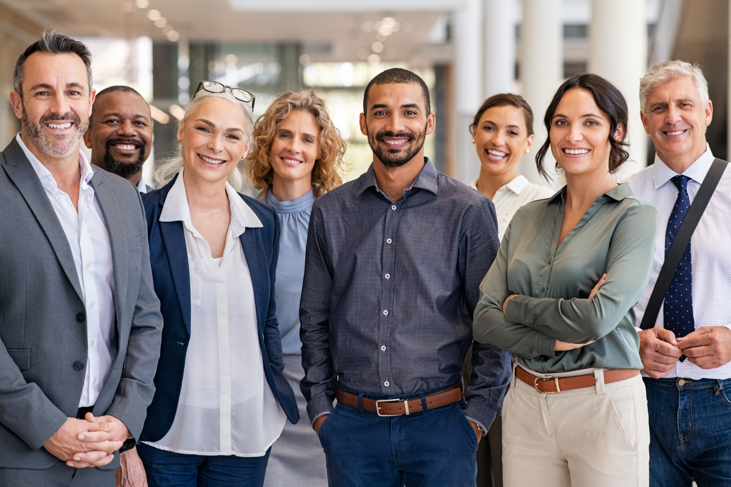 A group of confident marketing leaders smiling.